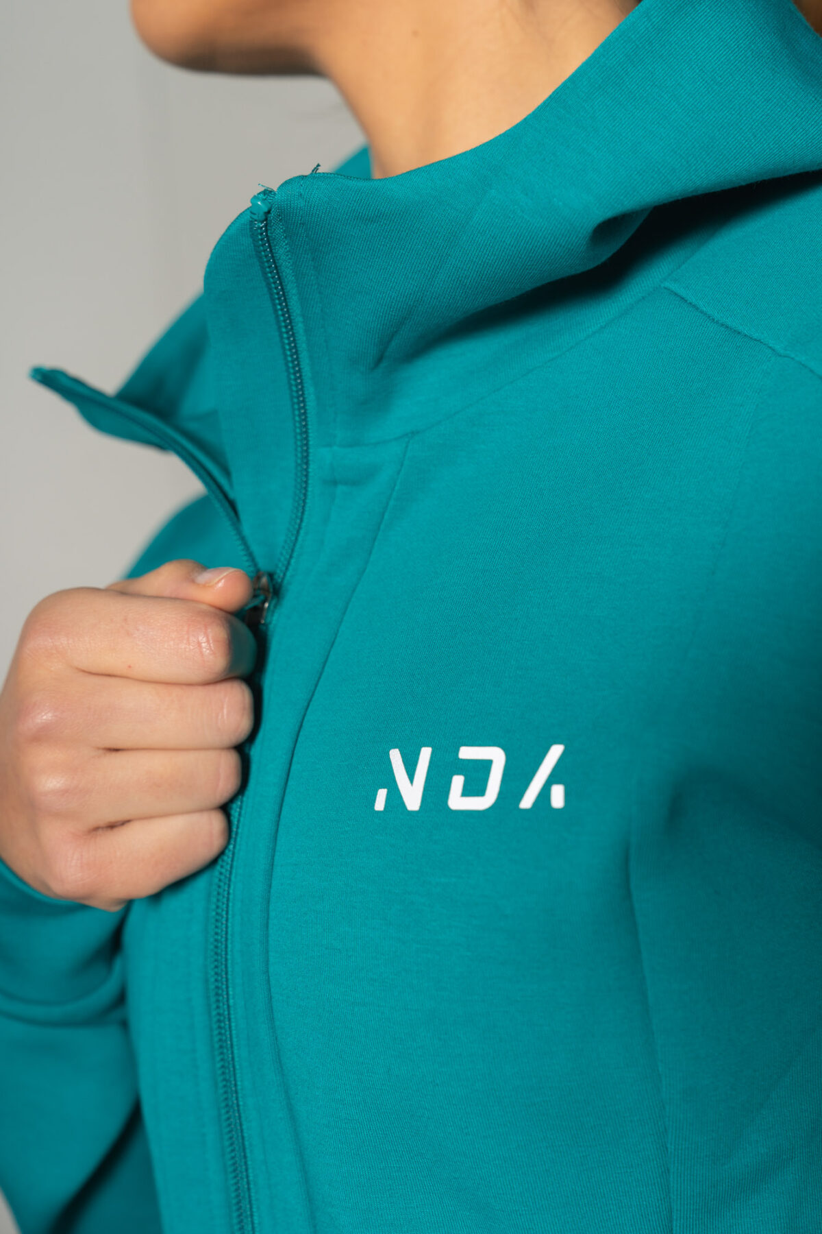 Deluxe Refined Hoodie (Teal), the ultimate combination of style and functionality. This shape-enhancing full zip hoodie is the perfect layering piece for any occasion.