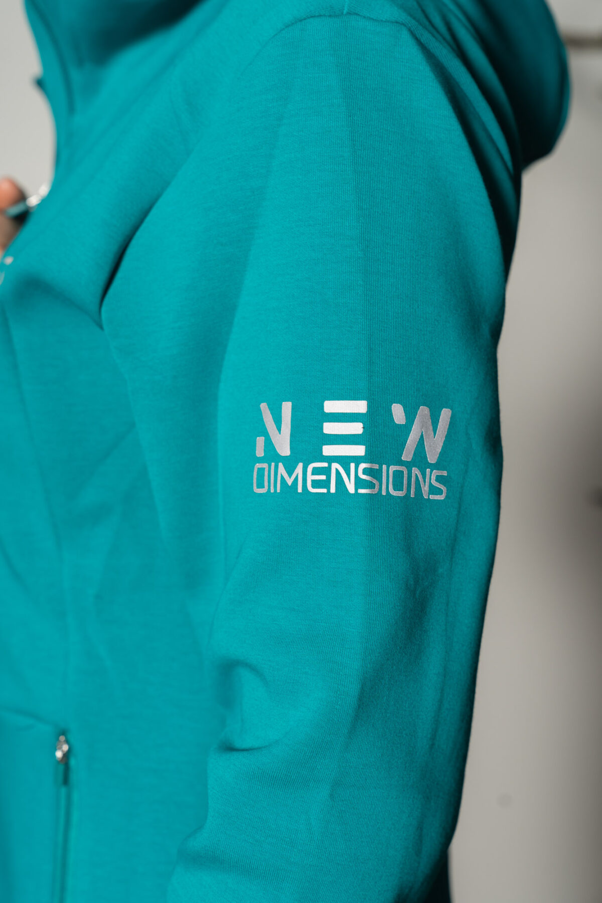 Deluxe Refined Hoodie (Teal), the ultimate combination of style and functionality. This shape-enhancing full zip hoodie is the perfect layering piece for any occasion.