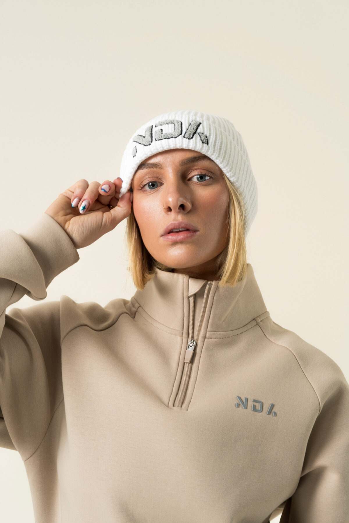 Stay warm while you are on the move in our new ribbed knit beanie. The soft knit feel gives you that extra cosy comfort. An embroidered flock NDA logo also gives you a touch of subtle style.