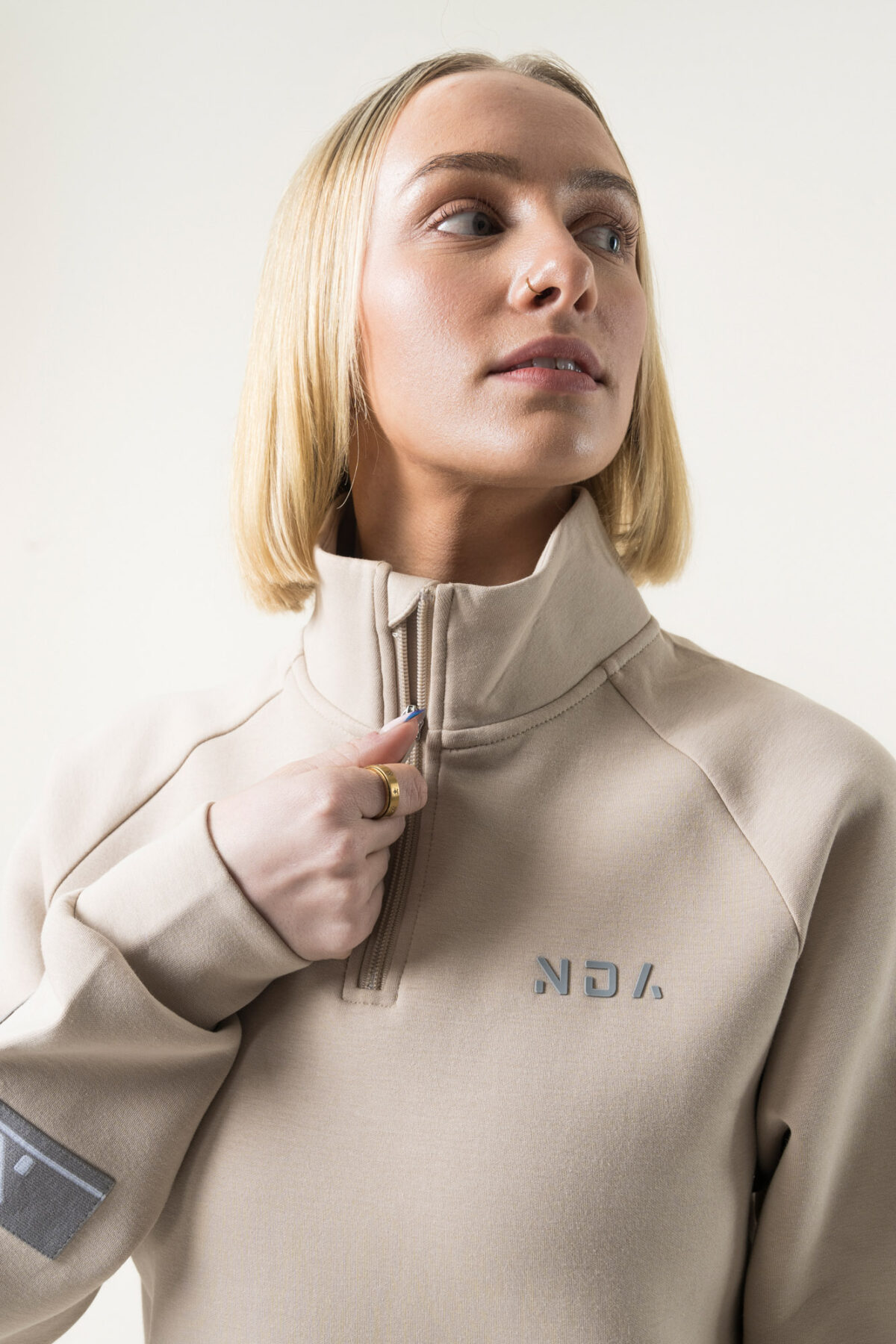 Premium & Practical - the Deluxe ¼ Zip (Beige). Made from our deluxe material, this 1/4 zip is designed to keep you warm and cosy during the colder months. The fabric is soft & heavy to the touch and provides ultimate comfort, making it a must-have for your wardrobe.