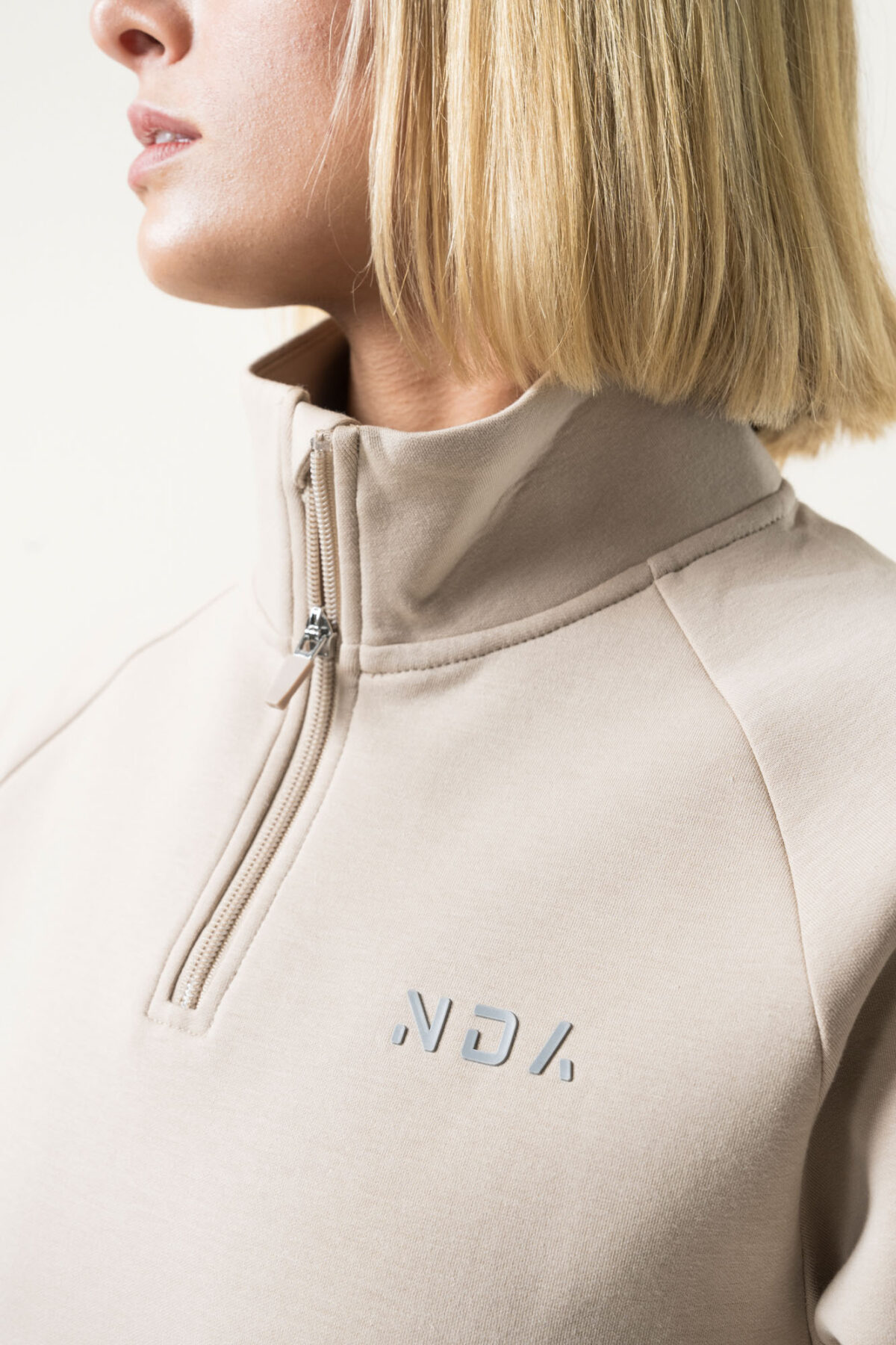 Premium & Practical - the Deluxe ¼ Zip (Beige). Made from our deluxe material, this 1/4 zip is designed to keep you warm and cosy during the colder months. The fabric is soft & heavy to the touch and provides ultimate comfort, making it a must-have for your wardrobe.