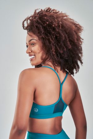 Introducing our Rise Sports Bra (Teal) from the Spring Summer Collection, featuring a sleek design with removable pads for customizable support. The trend mesh detail on the back not only adds a stylish touch but also enhances breathability, keeping you cool and comfortable during workouts.
