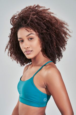 Introducing our Rise Sports Bra (Teal) from the Spring Summer Collection, featuring a sleek design with removable pads for customizable support. The trend mesh detail on the back not only adds a stylish touch but also enhances breathability, keeping you cool and comfortable during workouts.