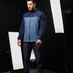 Elevate your activewear wardrobe with our latest addition: the Hybrid Zip Jacket (Navy). Part of the prestigious  Collection, this men's jacket is designed for performance and style. Crafted from lightweight material, it offers an exceptional combination of comfort and functionality, perfect for any activity or casual wear.