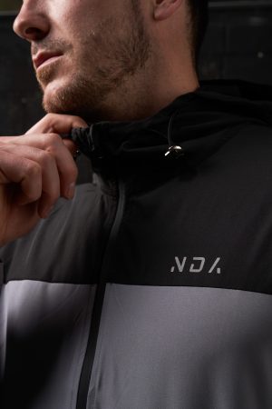 Elevate your activewear wardrobe with our latest addition: the Hybrid Zip Jacket (Black). Part of the prestigious  Collection, this men's jacket is designed for performance and style. Crafted from lightweight material, it offers an exceptional combination of comfort and functionality, perfect for any activity or casual wear.