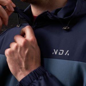 Elevate your activewear wardrobe with our latest addition: the Hybrid Zip Jacket (Navy). Part of the prestigious  Collection, this men's jacket is designed for performance and style. Crafted from lightweight material, it offers an exceptional combination of comfort and functionality, perfect for any activity or casual wear.