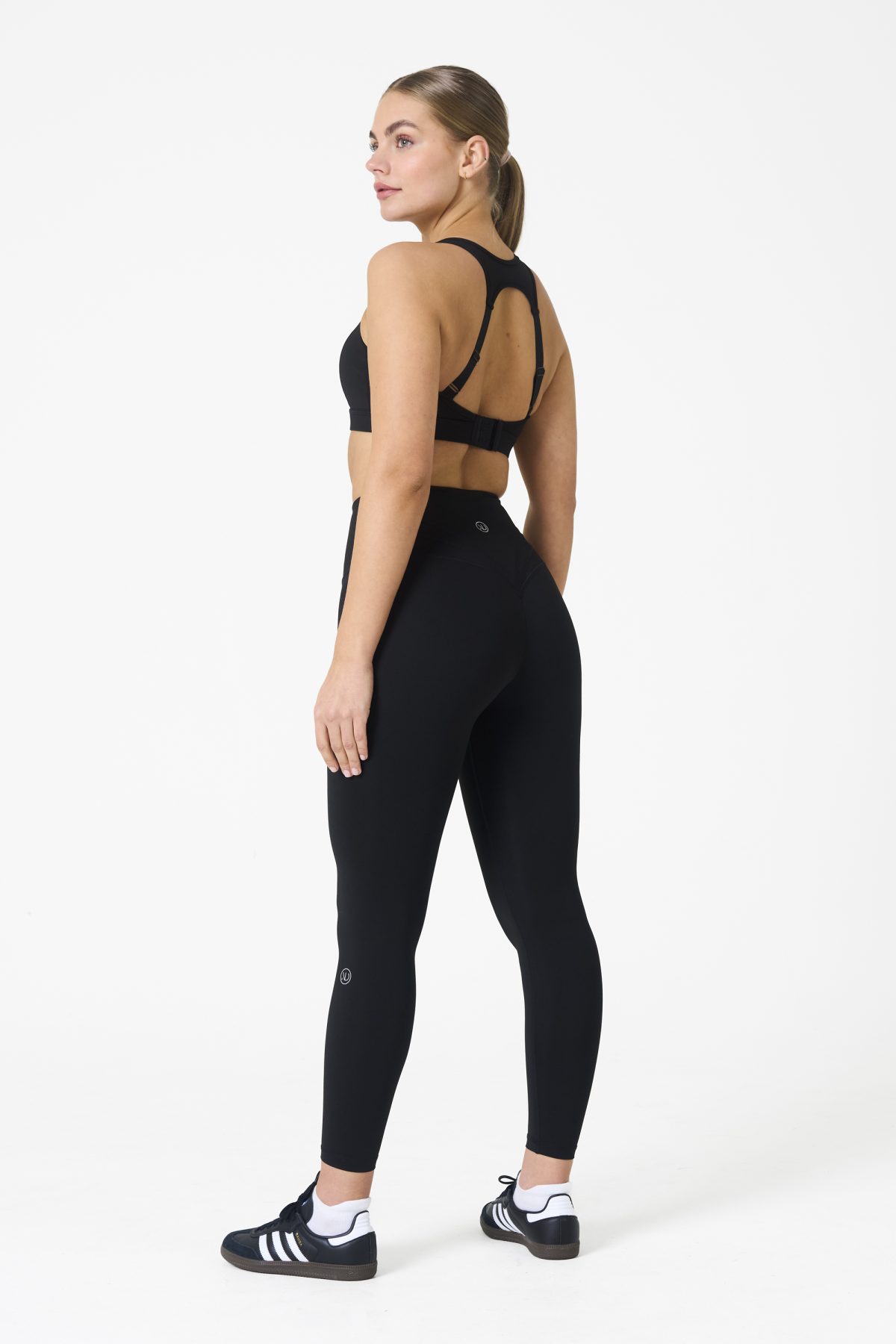 Elevate your workout wardrobe with the Legacy Legging (Black), designed to empower every movement. Part of our Legacy Activewear Collection, these leggings combine superior support, unmatched comfort, and timeless style. Featuring a high-waisted fit with a flat-line drawstring for adjustable comfort, these leggings are crafted to stay put through every squat, lunge, and stretch. The back-enhanced detail adds a flattering finish, making these leggings a staple for both gym sessions and casual wear.