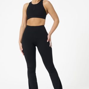 Move freely and confidently with the Legacy Flare Legging (Black), designed for comfort, support, and style. Part of our Legacy Activewear Collection, this legging combines innovative features with a modern flair to elevate your active wardrobe. The high-waisted design ensures a secure fit, while the flatline drawstring offers customizable support for every movement. The subtle back-enhanced detail adds a sculpted, flattering touch. The flare silhouette delivers a trendy yet functional look, giving you ease of movement whether you're in the gym or out and about.