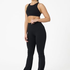 Move freely and confidently with the Legacy Flare Legging (Black), designed for comfort, support, and style. Part of our Legacy Activewear Collection, this legging combines innovative features with a modern flair to elevate your active wardrobe. The high-waisted design ensures a secure fit, while the flatline drawstring offers customizable support for every movement. The subtle back-enhanced detail adds a sculpted, flattering touch. The flare silhouette delivers a trendy yet functional look, giving you ease of movement whether you're in the gym or out and about.