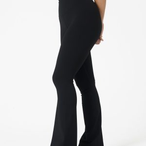 Move freely and confidently with the Legacy Flare Legging (Black), designed for comfort, support, and style. Part of our Legacy Activewear Collection, this legging combines innovative features with a modern flair to elevate your active wardrobe. The high-waisted design ensures a secure fit, while the flatline drawstring offers customizable support for every movement. The subtle back-enhanced detail adds a sculpted, flattering touch. The flare silhouette delivers a trendy yet functional look, giving you ease of movement whether you're in the gym or out and about.