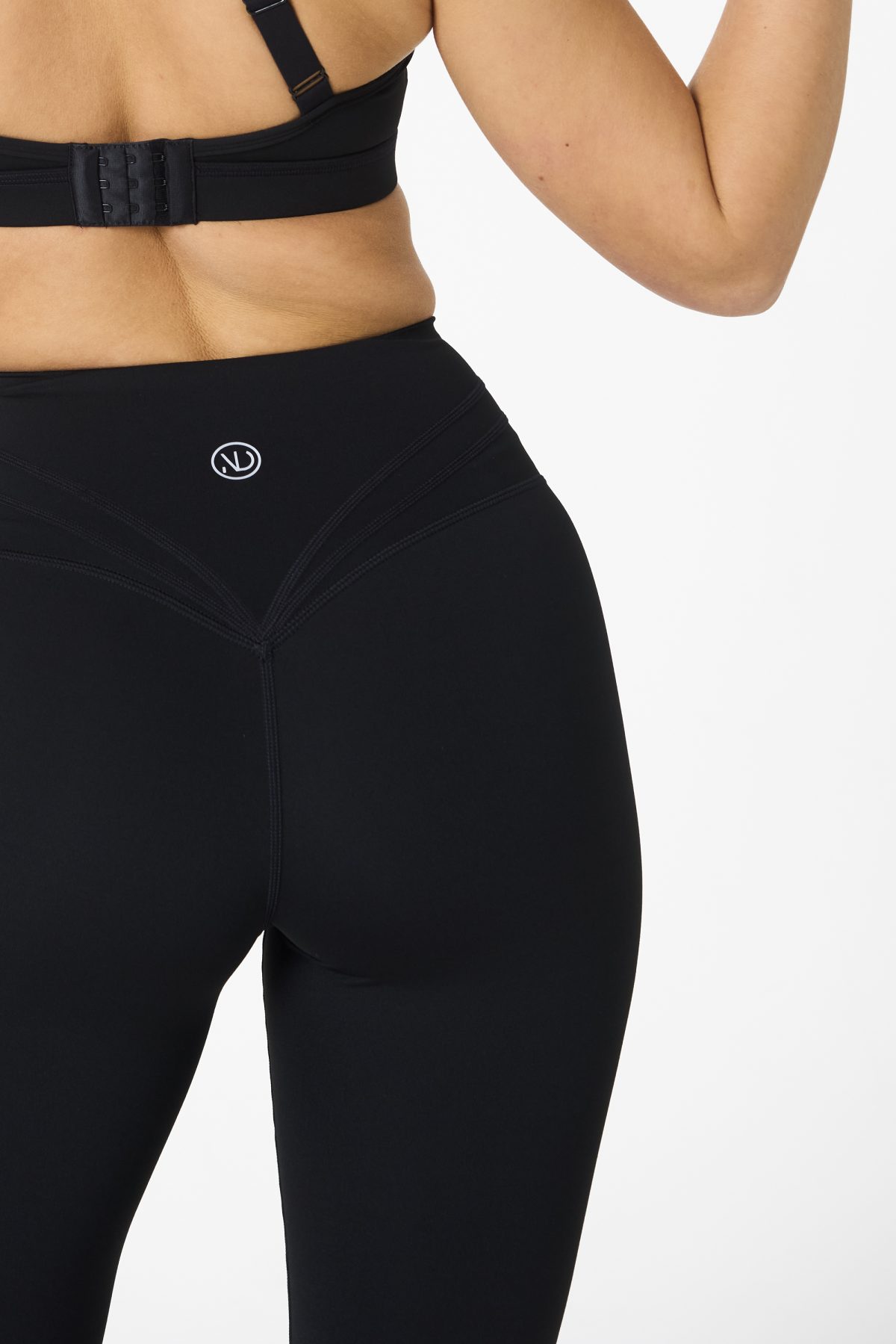 Move freely and confidently with the Legacy Flare Legging (Black), designed for comfort, support, and style. Part of our Legacy Activewear Collection, this legging combines innovative features with a modern flair to elevate your active wardrobe. The high-waisted design ensures a secure fit, while the flatline drawstring offers customizable support for every movement. The subtle back-enhanced detail adds a sculpted, flattering touch. The flare silhouette delivers a trendy yet functional look, giving you ease of movement whether you're in the gym or out and about.