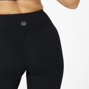 Move freely and confidently with the Legacy Flare Legging (Black), designed for comfort, support, and style. Part of our Legacy Activewear Collection, this legging combines innovative features with a modern flair to elevate your active wardrobe. The high-waisted design ensures a secure fit, while the flatline drawstring offers customizable support for every movement. The subtle back-enhanced detail adds a sculpted, flattering touch. The flare silhouette delivers a trendy yet functional look, giving you ease of movement whether you're in the gym or out and about.