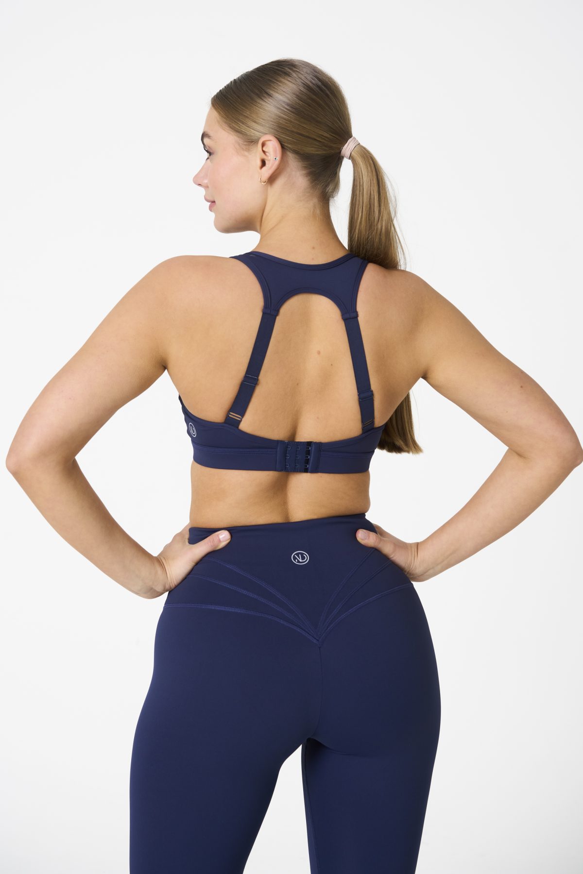 Elevate your workout wardrobe with the Legacy Legging (Navy), designed to empower every movement. Part of our Legacy Activewear Collection, these leggings combine superior support, unmatched comfort, and timeless style. Featuring a high-waisted fit with a flat-line drawstring for adjustable comfort, these leggings are crafted to stay put through every squat, lunge, and stretch. The back-enhanced detail adds a flattering finish, making these leggings a staple for both gym sessions and casual wear.