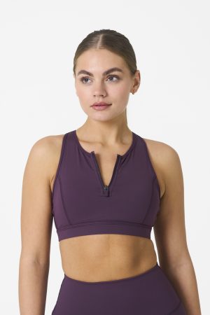 Elevate your workout wardrobe with the Legacy Zip Bra (Plum) from our Legacy Activewear Collection. Designed for movement, support, and ultimate comfort, this sports bra combines functionality with trend-forward style.