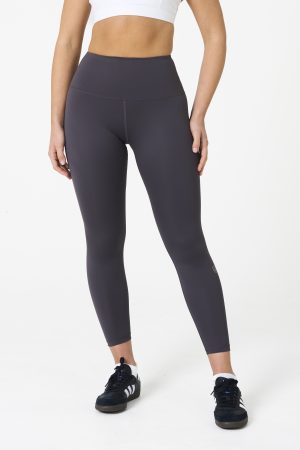 Elevate your workout wardrobe with the Legacy Legging (Dark Grey), designed to empower every movement. Part of our Legacy Activewear Collection, these leggings combine superior support, unmatched comfort, and timeless style. Featuring a high-waisted fit with a flat-line drawstring for adjustable comfort, these leggings are crafted to stay put through every squat, lunge, and stretch. The back-enhanced detail adds a flattering finish, making these leggings a staple for both gym sessions and casual wear.