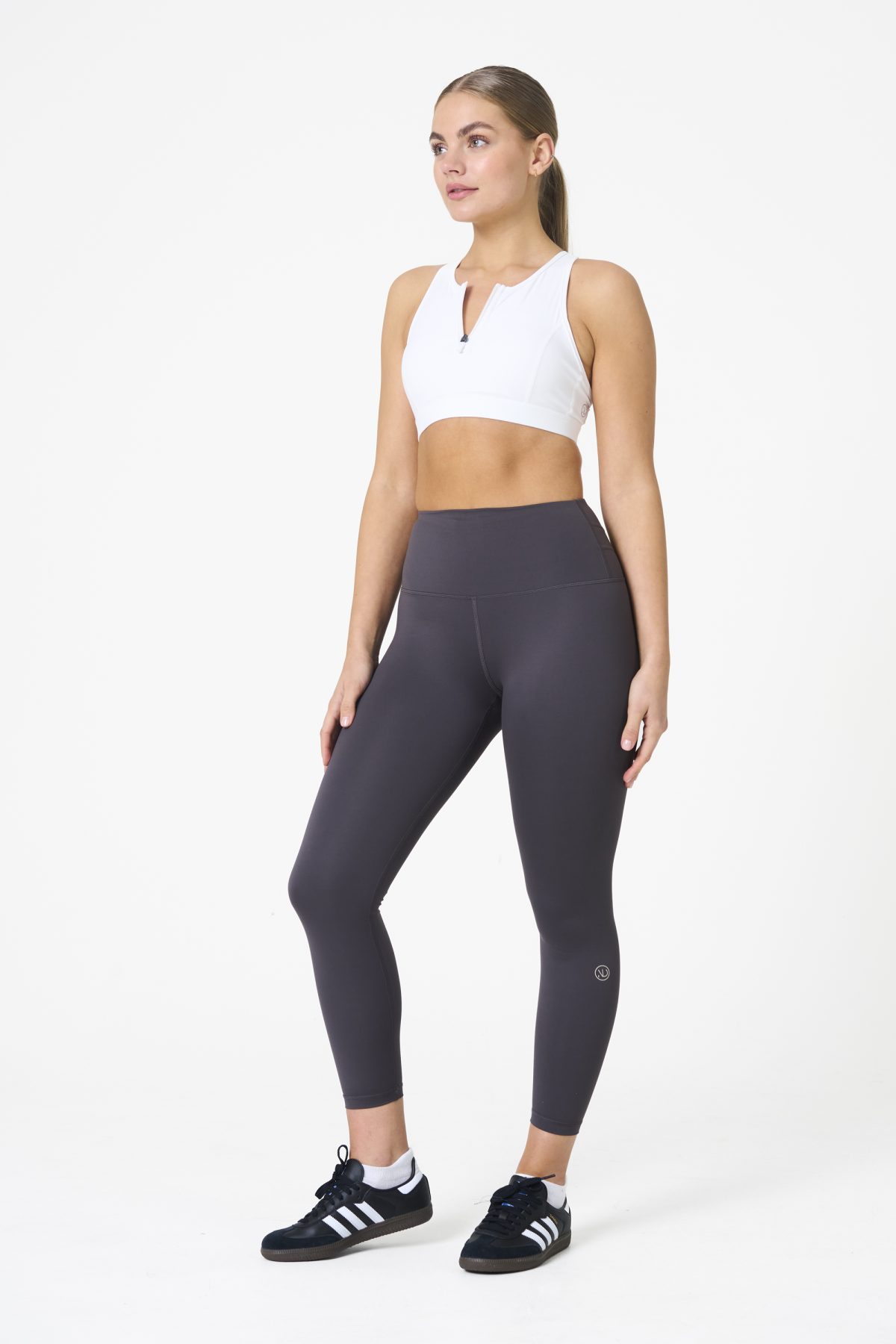 Elevate your workout wardrobe with the Legacy Legging (Dark Grey), designed to empower every movement. Part of our Legacy Activewear Collection, these leggings combine superior support, unmatched comfort, and timeless style. Featuring a high-waisted fit with a flat-line drawstring for adjustable comfort, these leggings are crafted to stay put through every squat, lunge, and stretch. The back-enhanced detail adds a flattering finish, making these leggings a staple for both gym sessions and casual wear.