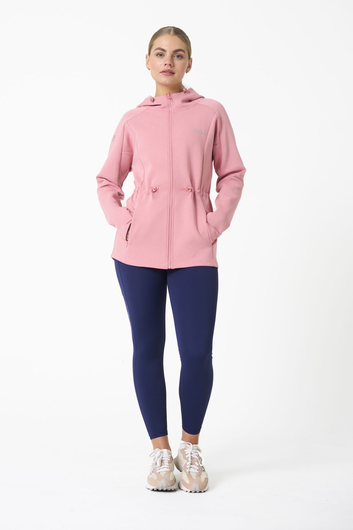 Elevate your activewear game with the Legacy Zip Hoodie (Blush Pink) from our Legacy Activewear Collection. Designed for ultimate movement, support, and comfort, this hoodie seamlessly blends practicality with style. The full-zip closure offers effortless wearability, while the adjustable hood and elasticated waist ensure a personalized fit. Perfect for your on-the-go lifestyle, it features two convenient pockets: a secure zipped pocket for essentials and a classic open pocket for quick access. The Legacy Zip Hoodie is your go-to for both functionality and trend-forward fashion.