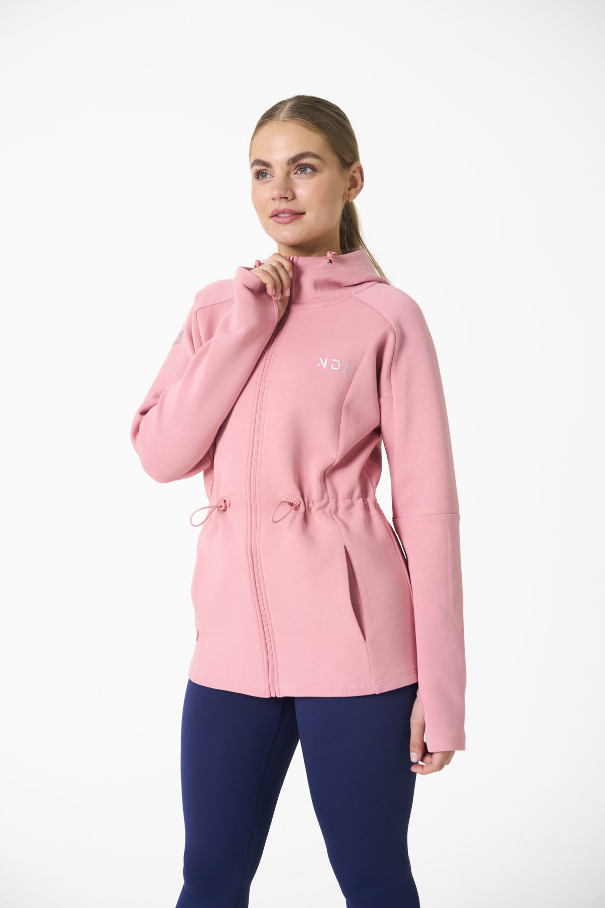 Elevate your activewear game with the Legacy Zip Hoodie (Blush Pink) from our Legacy Activewear Collection. Designed for ultimate movement, support, and comfort, this hoodie seamlessly blends practicality with style. The full-zip closure offers effortless wearability, while the adjustable hood and elasticated waist ensure a personalized fit. Perfect for your on-the-go lifestyle, it features two convenient pockets: a secure zipped pocket for essentials and a classic open pocket for quick access. The Legacy Zip Hoodie is your go-to for both functionality and trend-forward fashion.