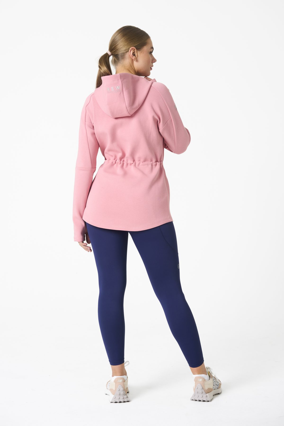 Elevate your activewear game with the Legacy Zip Hoodie (Blush Pink) from our Legacy Activewear Collection. Designed for ultimate movement, support, and comfort, this hoodie seamlessly blends practicality with style. The full-zip closure offers effortless wearability, while the adjustable hood and elasticated waist ensure a personalized fit. Perfect for your on-the-go lifestyle, it features two convenient pockets: a secure zipped pocket for essentials and a classic open pocket for quick access. The Legacy Zip Hoodie is your go-to for both functionality and trend-forward fashion.