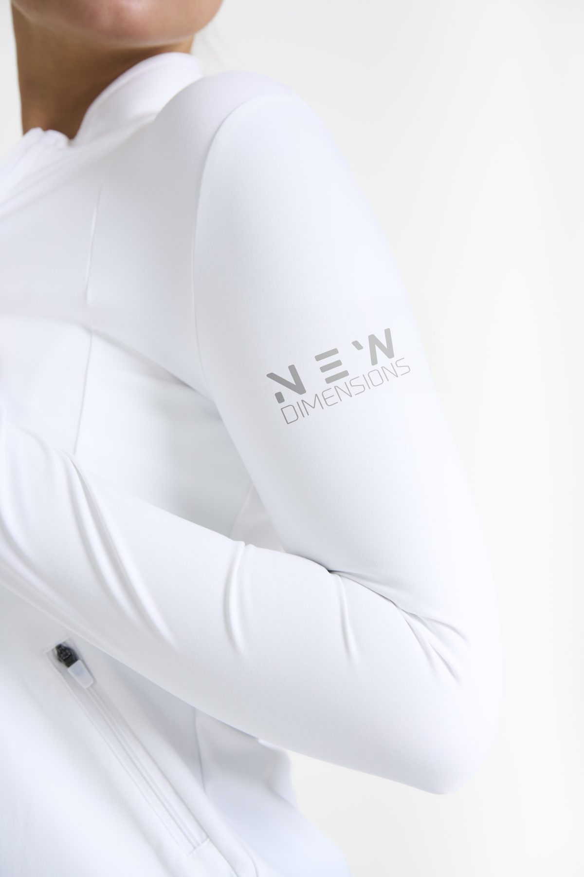 Elevate your activewear game with the Legacy Zip Jacket (White), designed for those who value movement, support, and unmatched comfort. Crafted from a premium blend of 75% Nylon and 25% Spandex, this jacket offers a lightweight yet durable feel that keeps you supported during any activity.