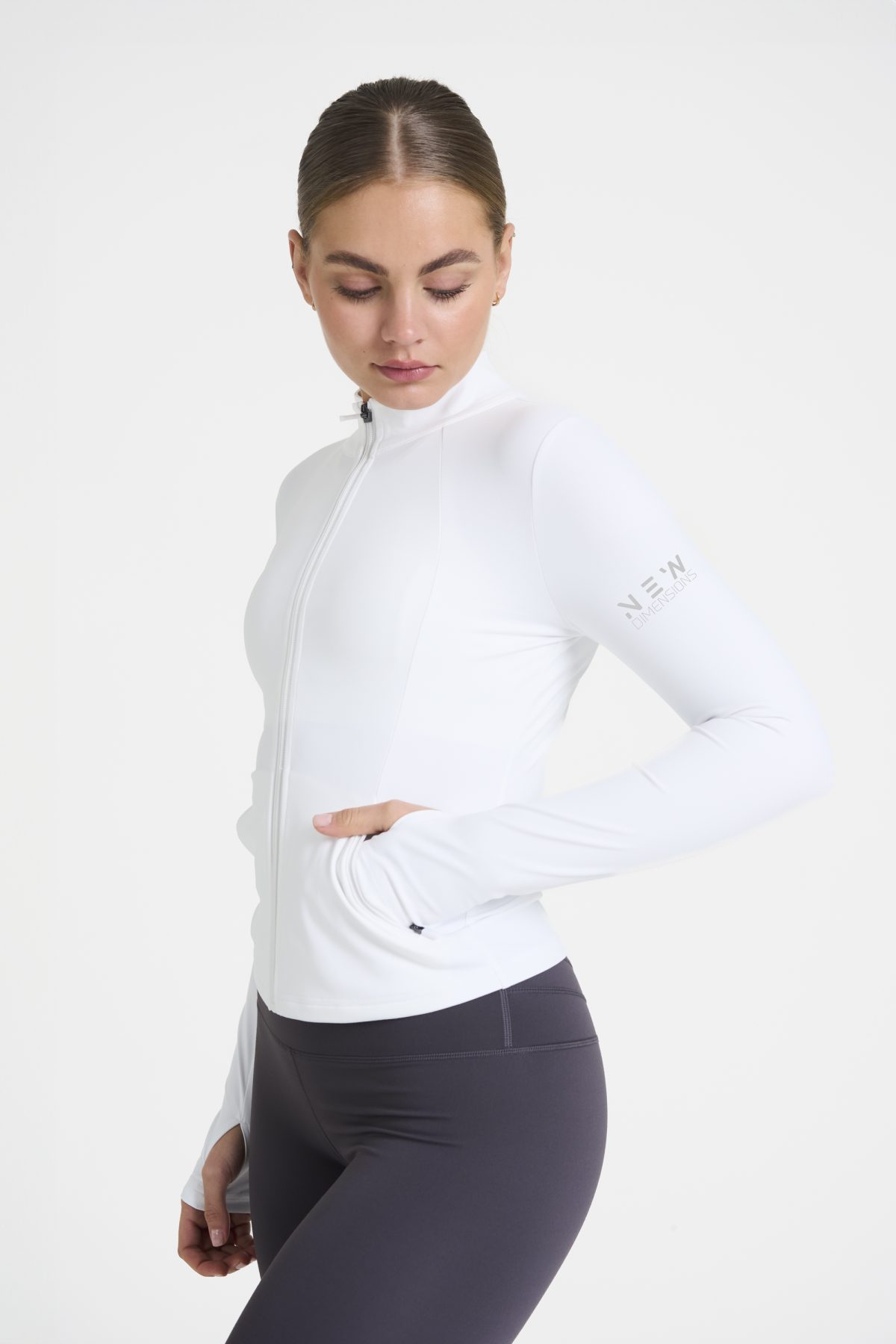 Elevate your activewear game with the Legacy Zip Jacket (White), designed for those who value movement, support, and unmatched comfort. Crafted from a premium blend of 75% Nylon and 25% Spandex, this jacket offers a lightweight yet durable feel that keeps you supported during any activity.