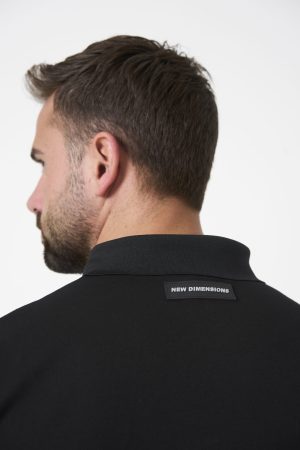Elevate your golf game with the Men's Elements Golf Long Sleeve Polo (Black), designed to meet the demands of movement and performance on the course. Crafted from a premium cotton and spandex blend, this polo offers a lightweight feel and unmatched softness for all-day comfort.
