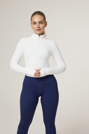 Elevate your activewear game with the Tapered Zip Jacket (White) from our Elements Collection. Designed with a modern, short-length cut, this jacket provides a sleek, fitted fit that complements your every move. Crafted from a premium blend of 75% Nylon and 25% Spandex, it offers the perfect balance of stretch and durability to keep up with your active lifestyle.