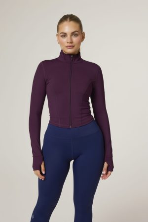 Elevate your activewear game with the Tapered Zip Jacket (Plum) from our Elements Collection. Designed with a modern, short-length cut, this jacket provides a sleek, fitted fit that complements your every move. Crafted from a premium blend of 75% Nylon and 25% Spandex, it offers the perfect balance of stretch and durability to keep up with your active lifestyle.