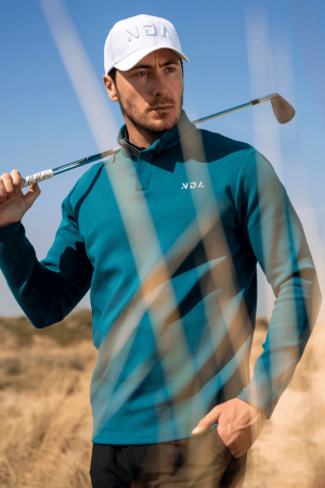 For those looking for a stylish and performance-driven 1/4 zip, the Tempo Golf 1/4 Zip (Teal) is the perfect choice. With its premium material, flatline design, and slimming fit, you can look and feel your best while playing golf. Whether you’re a beginner or a professional, the Golf 1/4 Zip is the perfect choice for any golfer.