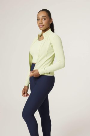 The Signature Rib Zip Jacket (Lime) is the perfect fusion of structure and softness — designed to enhance your shape while keeping comfort at the forefront. Crafted from premium ribbed fabric with just the right amount of stretch, this jacket contours effortlessly to your body. The full-zip front offers versatile styling, while the seamless collar keeps the look sleek and streamlined. A subtle logo detail on the side adds a premium, understated touch. Whether you're heading to the studio or layering up post-workout, this jacket moves with you and flatters every angle.