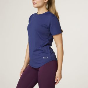 Introducing the Women's Training Tee (Navy) - the ultimate workout companion for fitness enthusiasts! Made with a perfect blend of polyester and spandex, this tee offers maximum comfort and flexibility for all your training needs. This tee not only looks great but also allows for a full range of motion during your workouts. But what sets this training tee apart is its innovative heat gear technology. This technology is designed to quickly and efficiently pull sweat away from your skin, keeping you dry and comfortable even during the most intense training sessions.
