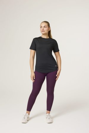 Introducing the Women's Training Tee (Black) - the ultimate workout companion for fitness enthusiasts! Made with a perfect blend of polyester and spandex, this tee offers maximum comfort and flexibility for all your training needs. This tee not only looks great but also allows for a full range of motion during your workouts. But what sets this training tee apart is its innovative heat gear technology. This technology is designed to quickly and efficiently pull sweat away from your skin, keeping you dry and comfortable even during the most intense training sessions.