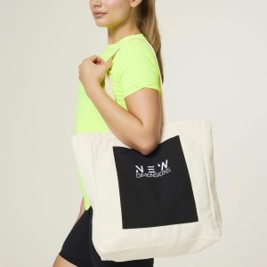 Effortlessly minimal with a bold touch, the Canva Tote Bag (Cream) is your perfect everyday carry-all. Crafted from durable canvas in a soft cream tone, this tote is both functional and versatile. The standout feature? A contrasting black front pocket adorned with our signature logo, adding a pop of style and easy-access storage. Spacious enough for your daily essentials — from gym gear to groceries — and sturdy enough to keep up with your lifestyle.