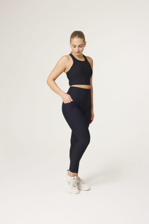 Sculpted support meets everyday functionality in our Rib Compression Legging (Black) — the perfect piece for this season and beyond. Crafted from breathable ribbed fabric, these leggings offer high-performance compression with a flattering, second-skin feel. Featuring a back-enhancing contour, adjustable drawstring waist, and squat-proof coverage, they’re designed to move with you through every rep, stretch, or step. A seamless side pocket holds your essentials, and a subtle premium logo on the back adds a polished touch. From workouts to weekends, this is the legging that does it all.