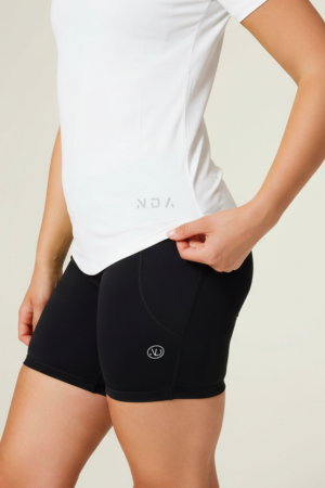 Introducing the Women's Training Tee (White) - the ultimate workout companion for fitness enthusiasts! Made with a perfect blend of polyester and spandex, this tee offers maximum comfort and flexibility for all your training needs. This tee not only looks great but also allows for a full range of motion during your workouts. But what sets this training tee apart is its innovative heat gear technology. This technology is designed to quickly and efficiently pull sweat away from your skin, keeping you dry and comfortable even during the most intense training sessions.